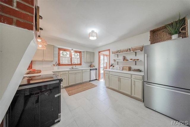 1003 S Warfel St, Salem, MO 65560 - kitchen with stainless steel appliances, a sink, tasteful backsplash, light countertops, and open shelves
