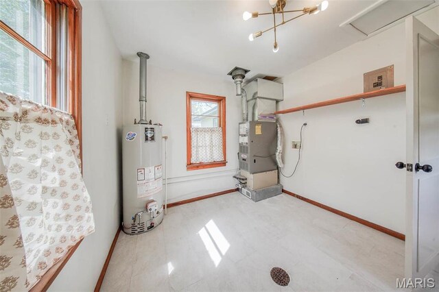 1003 S Warfel St, Salem, MO 65560 - utility room featuring gas water heater and heating unit