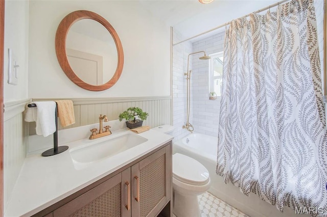 1003 S Warfel St, Salem, MO 65560 - full bath featuring toilet, shower / bath combo, vanity, and a wainscoted wall