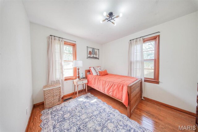 1003 S Warfel St, Salem, MO 65560 - bedroom featuring wood finished floors and baseboards