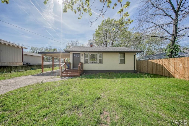 1003 S Warfel St, Salem, MO 65560 - view of front of property with asphalt driveway, a carport, and a chimney