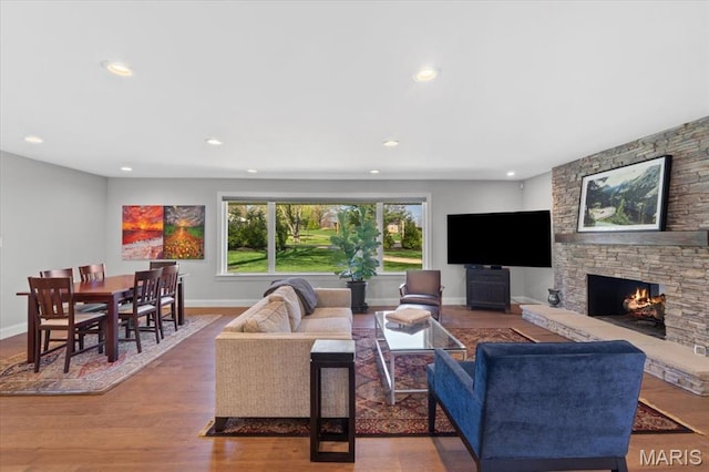 12 Westfield, Frontenac, MO 63131 - living area featuring a fireplace, recessed lighting, baseboards, and wood finished floors