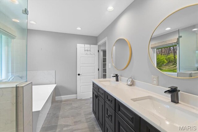 12 Westfield, Frontenac, MO 63131 - full bath with a freestanding tub, double vanity, an enclosed shower, recessed lighting, and marble finish flooring