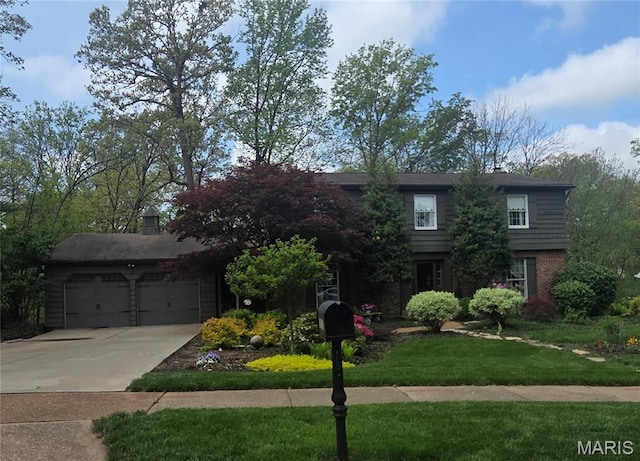14590 Ansonborough Ct, Chesterfield, MO 63017 - view of front of home featuring a front lawn, a garage, brick siding, and concrete driveway