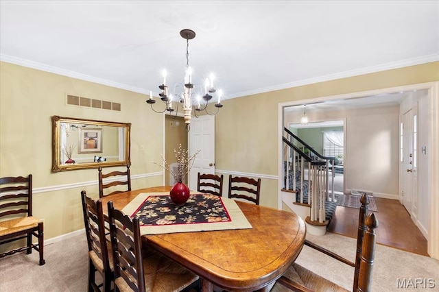 14590 Ansonborough Ct, Chesterfield, MO 63017 - dining room with a chandelier, stairway, ornamental molding, carpet, and baseboards