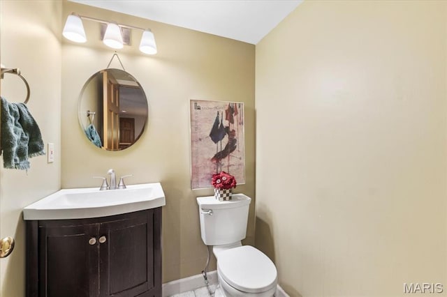 14590 Ansonborough Ct, Chesterfield, MO 63017 - bathroom featuring toilet, baseboards, and vanity