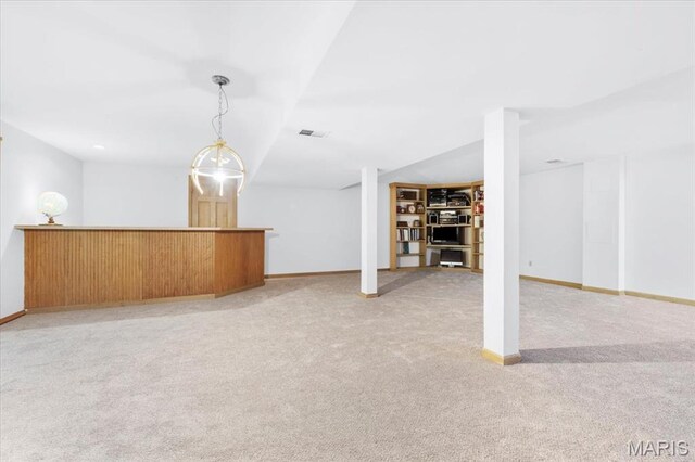 14590 Ansonborough Ct, Chesterfield, MO 63017 - finished basement featuring light colored carpet, baseboards, and bar area