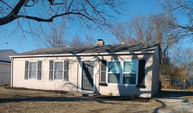 607 Saint Monica Dr E, St Louis, IL 62206 - view of front of property featuring a chimney and a shingled roof