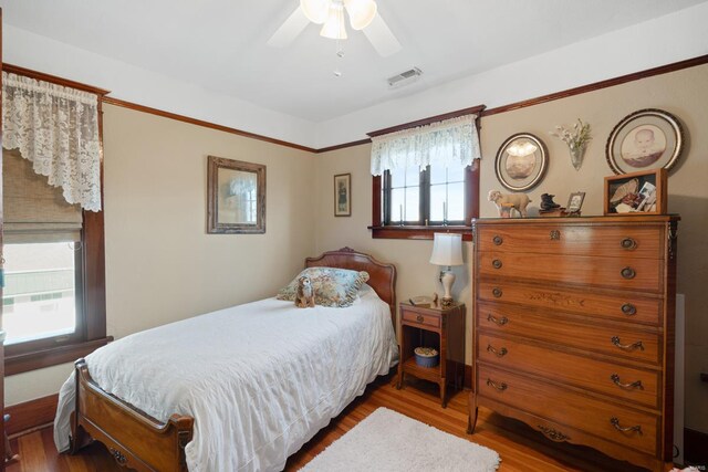 bedroom featuring wood finished floors and ceiling fan