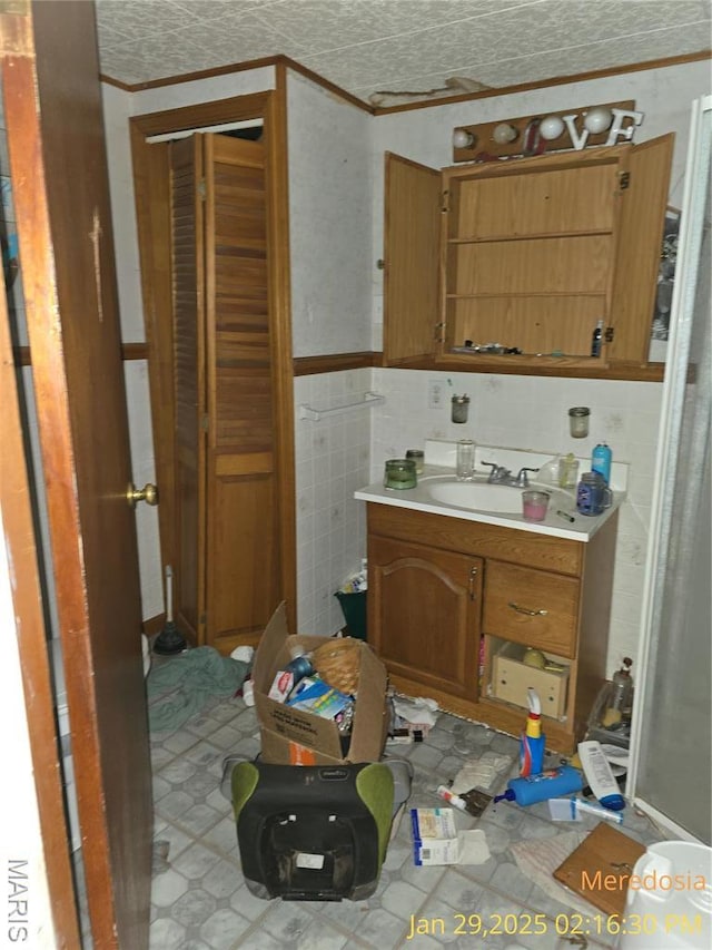 514 NW Washington St, Meredosia, IL 62665 - bathroom with ornamental molding and vanity