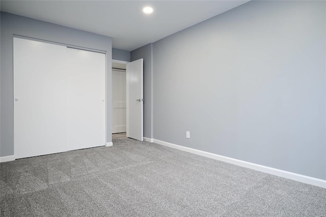 572 Coeur De Royale Dr Unit 108, Saint Louis, MO 63141 - unfurnished bedroom featuring carpet floors, a closet, baseboards, and recessed lighting