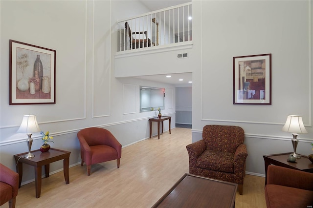 572 Coeur De Royale Dr Unit 108, Saint Louis, MO 63141 - living area with wood finished floors and baseboards