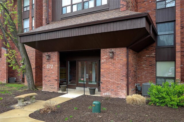 572 Coeur De Royale Dr Unit 108, Saint Louis, MO 63141 - entrance to property featuring central air condition unit and brick siding