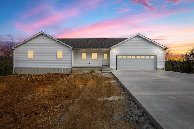 308 Blackberry Ln, Bismarck, MO 63624 - view of front of home featuring a garage, driveway, and roof with shingles