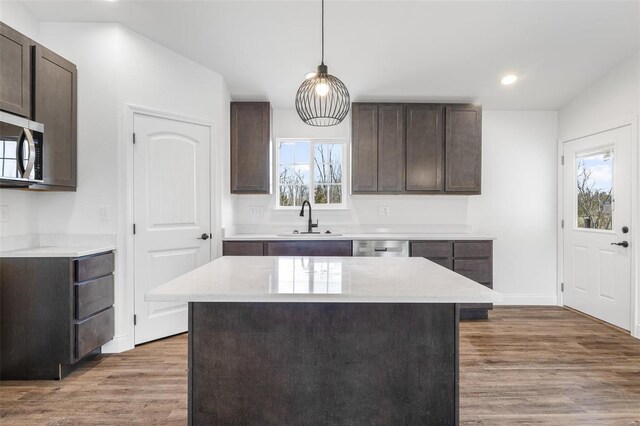 308 Blackberry Ln, Bismarck, MO 63624 - kitchen with a sink, stainless steel appliances, dark brown cabinets, wood finished floors, and recessed lighting