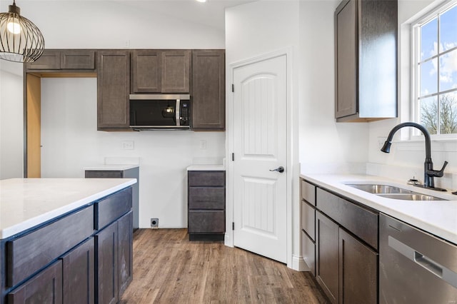 308 Blackberry Ln, Bismarck, MO 63624 - kitchen featuring stainless steel appliances, a sink, dark brown cabinets, wood finished floors, and light countertops