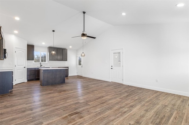 308 Blackberry Ln, Bismarck, MO 63624 - unfurnished living room featuring a sink, ceiling fan, wood finished floors, vaulted ceiling, and recessed lighting