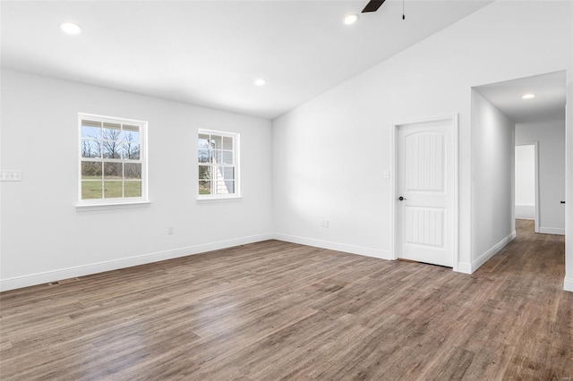 308 Blackberry Ln, Bismarck, MO 63624 - spare room with wood finished floors, recessed lighting, a ceiling fan, baseboards, and vaulted ceiling