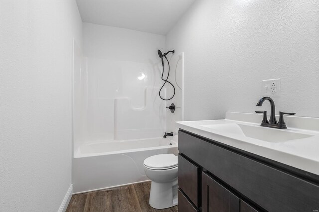 308 Blackberry Ln, Bismarck, MO 63624 - bathroom with wood finished floors, toilet, vanity, and washtub / shower combination