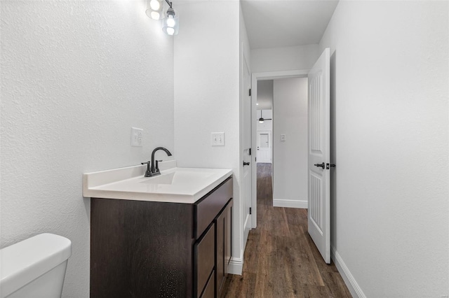 308 Blackberry Ln, Bismarck, MO 63624 - bathroom featuring vanity, wood finished floors, toilet, and baseboards