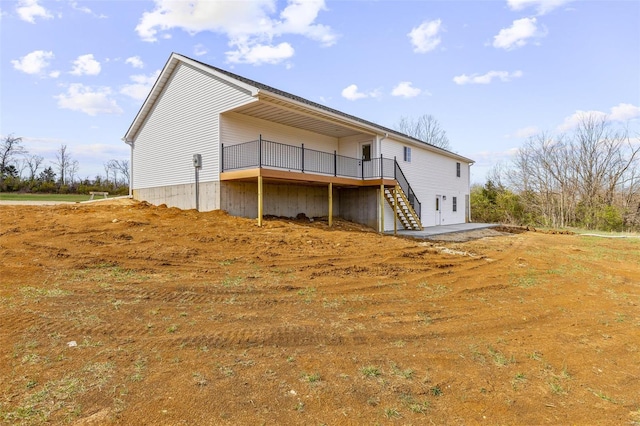308 Blackberry Ln, Bismarck, MO 63624 - back of property with a wooden deck and stairway