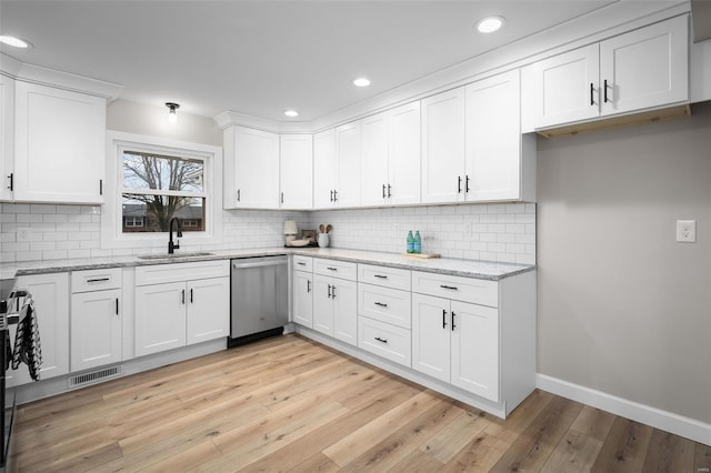 4 Tiger Dr, Wentzville, MO 63385 - kitchen with a sink, dishwasher, white cabinetry, decorative backsplash, and recessed lighting