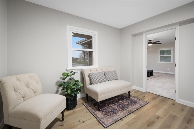 4 Tiger Dr, Wentzville, MO 63385 - living area featuring light wood-type flooring, baseboards, and ceiling fan