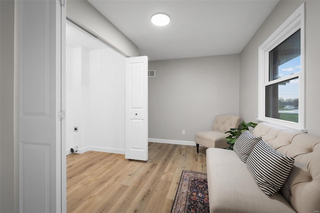 4 Tiger Dr, Wentzville, MO 63385 - living area featuring light wood-type flooring and baseboards