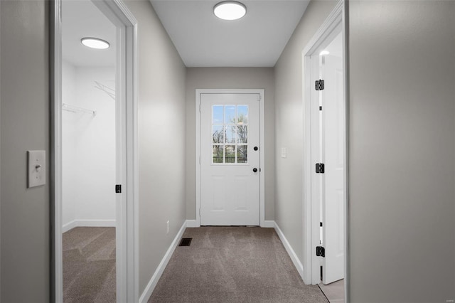 4 Tiger Dr, Wentzville, MO 63385 - doorway to outside featuring carpet and baseboards