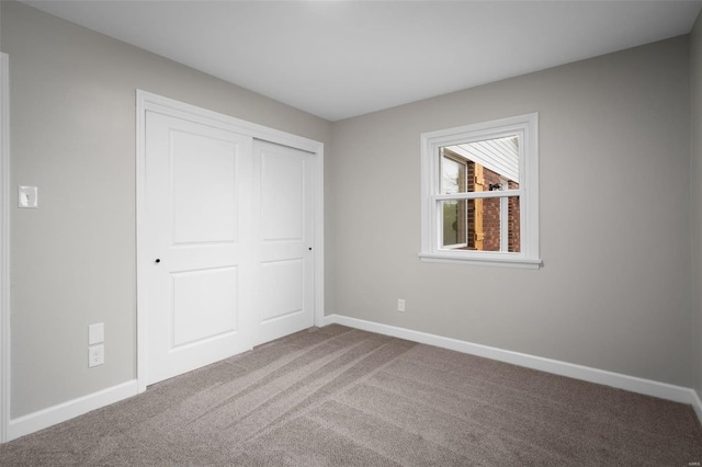4 Tiger Dr, Wentzville, MO 63385 - unfurnished bedroom featuring baseboards, carpet, and a closet
