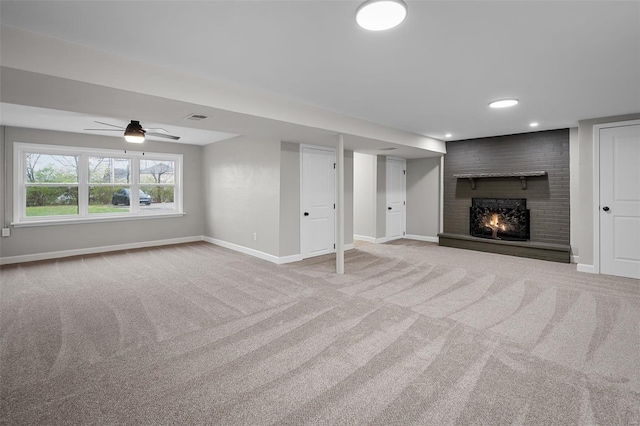 4 Tiger Dr, Wentzville, MO 63385 - basement with carpet, baseboards, a fireplace, ceiling fan, and recessed lighting