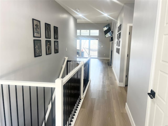 1564 Mandy Ln, Barnhart, MO 63012 - hallway with an upstairs landing, wood finished floors, and baseboards