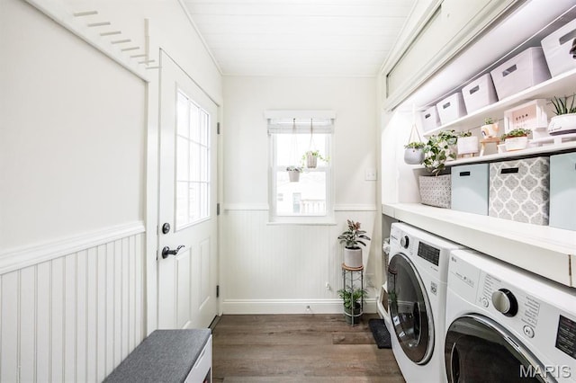 laundry room featuring separate washer and dryer, wainscoting, and wood finished floors