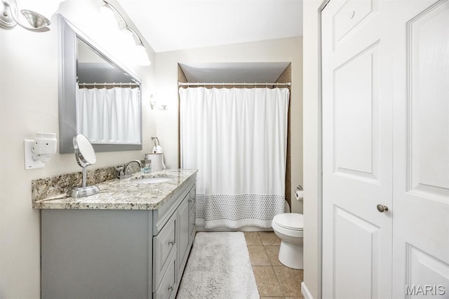 bathroom featuring vanity, tile patterned floors, toilet, and a shower with shower curtain