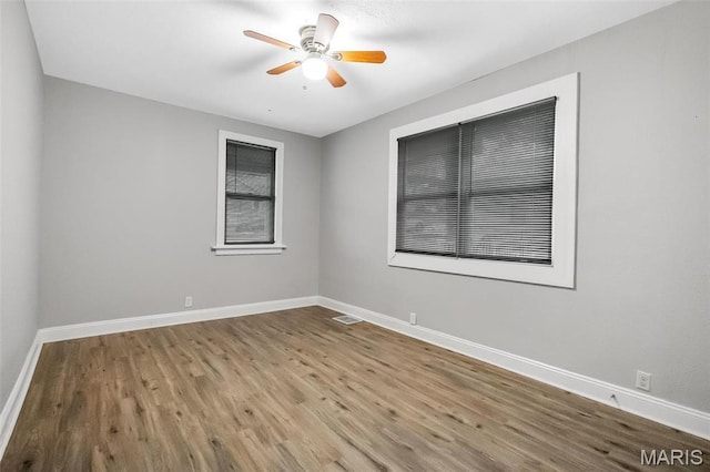 5537 Helen Ave, Saint Louis, MO 63136 - empty room featuring baseboards, wood finished floors, and ceiling fan