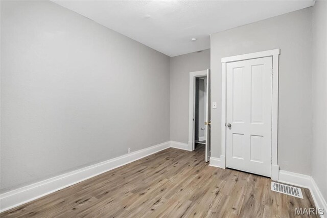 5537 Helen Ave, Saint Louis, MO 63136 - unfurnished bedroom with light wood-type flooring and baseboards