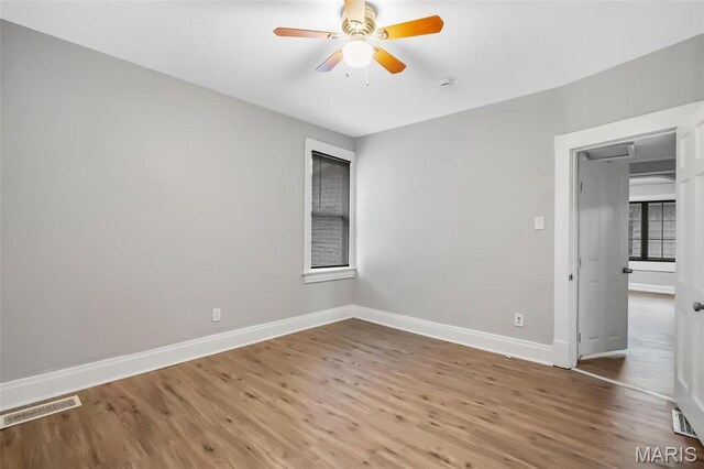5537 Helen Ave, Saint Louis, MO 63136 - unfurnished bedroom featuring baseboards, wood finished floors, and a ceiling fan