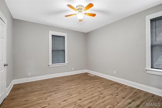 5537 Helen Ave, Saint Louis, MO 63136 - spare room with wood finished floors, baseboards, and a ceiling fan