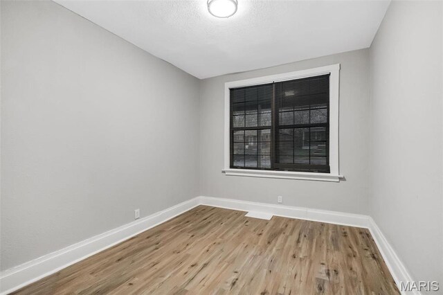 5537 Helen Ave, Saint Louis, MO 63136 - unfurnished room with baseboards and wood finished floors
