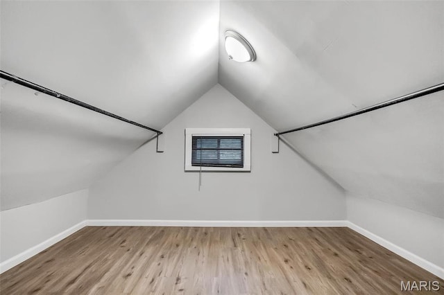 5537 Helen Ave, Saint Louis, MO 63136 - additional living space with vaulted ceiling, baseboards, and wood finished floors