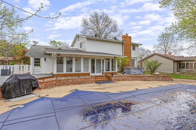 29 Park Charles Blvd N, Saint Peters, MO 63376 - back of house with entry steps, a patio, a sunroom, and a covered pool