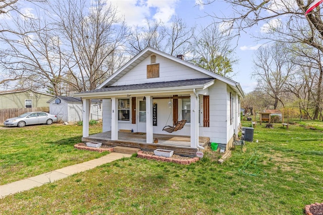 8 Donald St, Park Hills, MO 63601 - view of front of property featuring covered porch, a front yard, central AC unit, and roof with shingles