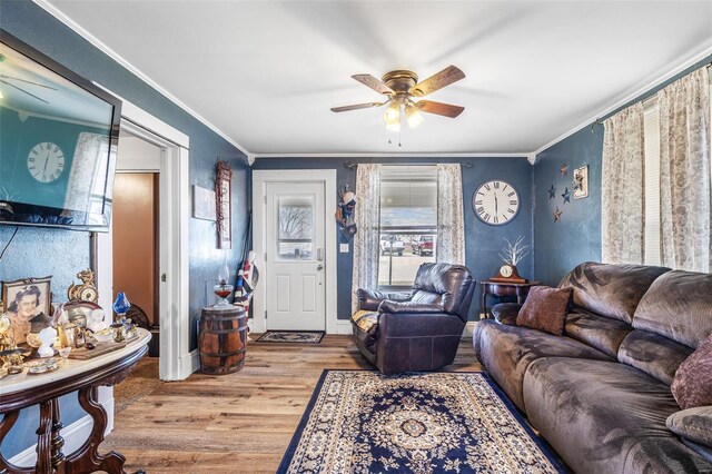 8 Donald St, Park Hills, MO 63601 - living room featuring crown molding, wood finished floors, healthy amount of natural light, and a ceiling fan