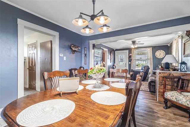 8 Donald St, Park Hills, MO 63601 - dining room with crown molding, wood finished floors, ceiling fan, baseboards, and a chandelier