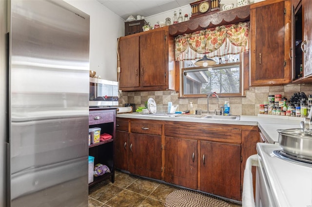 8 Donald St, Park Hills, MO 63601 - kitchen with electric stove, a sink, light countertops, backsplash, and brown cabinets