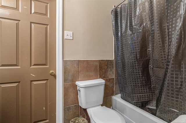 8 Donald St, Park Hills, MO 63601 - bathroom featuring tile walls, toilet, wainscoting, and shower / bath combination with curtain