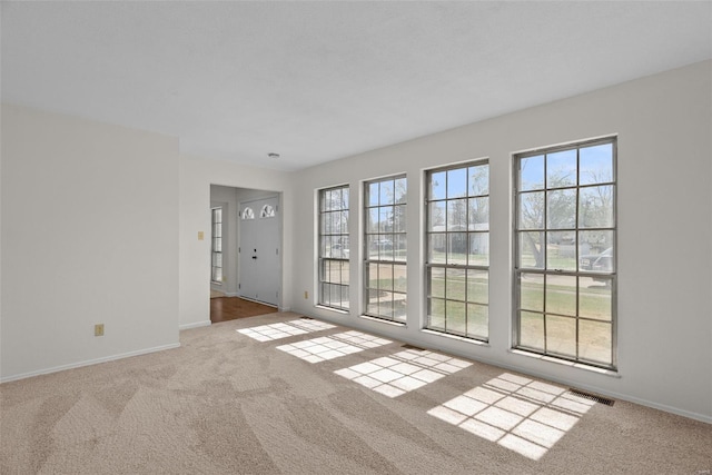 7 Beavertail Ct, Florissant, MO 63033 - carpeted empty room with baseboards