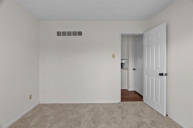 7 Beavertail Ct, Florissant, MO 63033 - empty room featuring carpet floors and baseboards