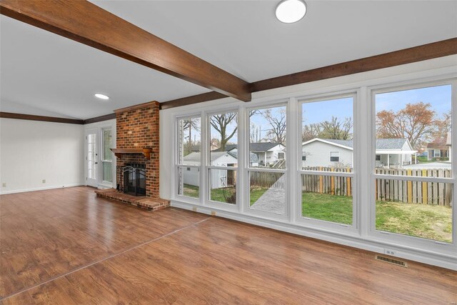 7 Beavertail Ct, Florissant, MO 63033 - unfurnished living room featuring wood finished floors, baseboards, and a residential view
