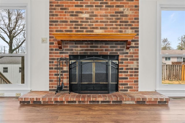 7 Beavertail Ct, Florissant, MO 63033 - detailed view of wood finished floors and a brick fireplace